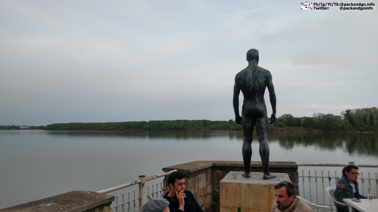 a statue next to the Danube river