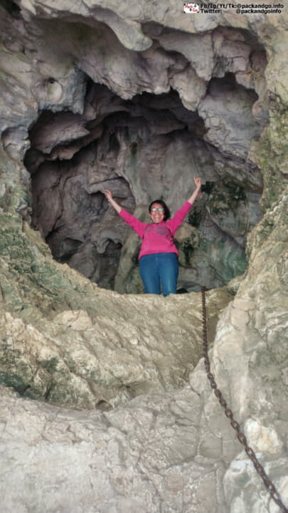 a woman on top of Bigar cave