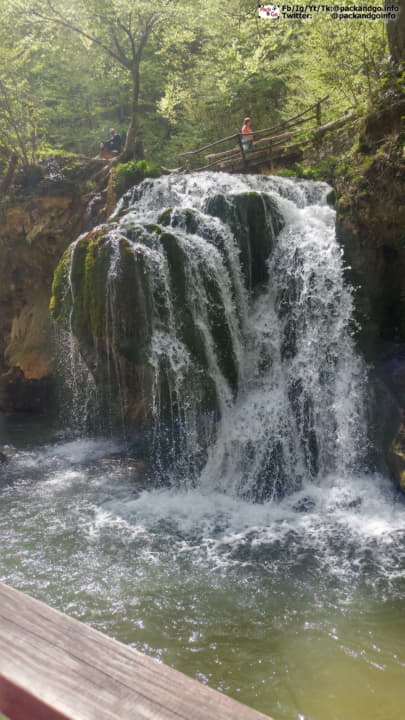 A waterfall near a river